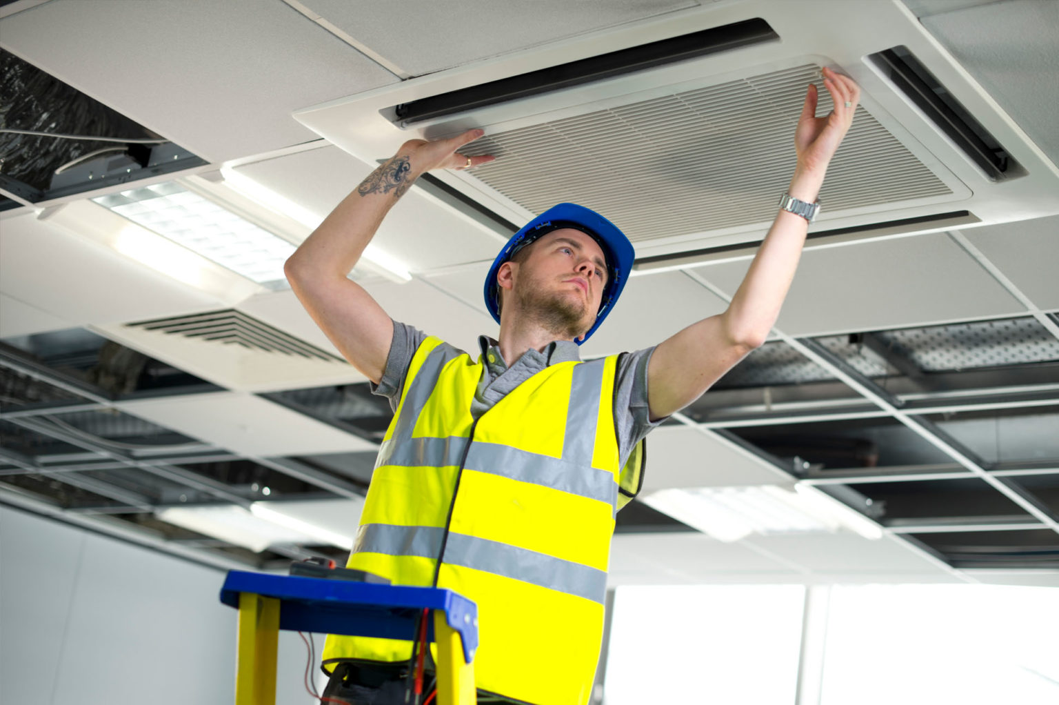 Engineer working on the heating, ventilation & air conditioning (hvac) system of a commercial building